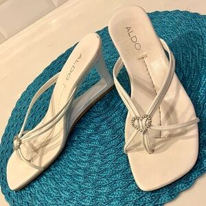 Aldo White Strappy Sandals with silver heart and open flat bottom heel, size 7